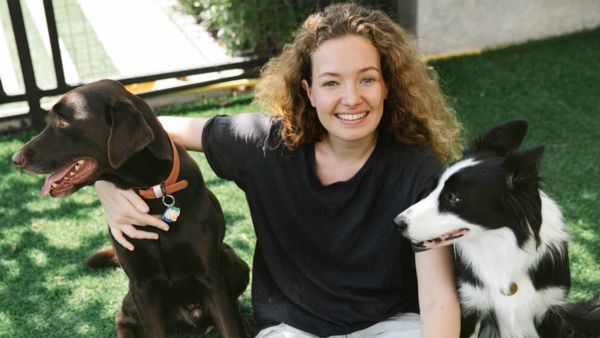 Dog trainer on artificial grass